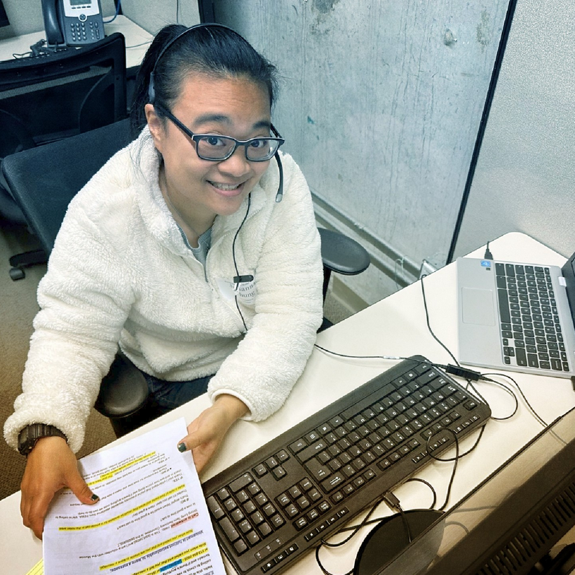 an image of Julianna taking calls